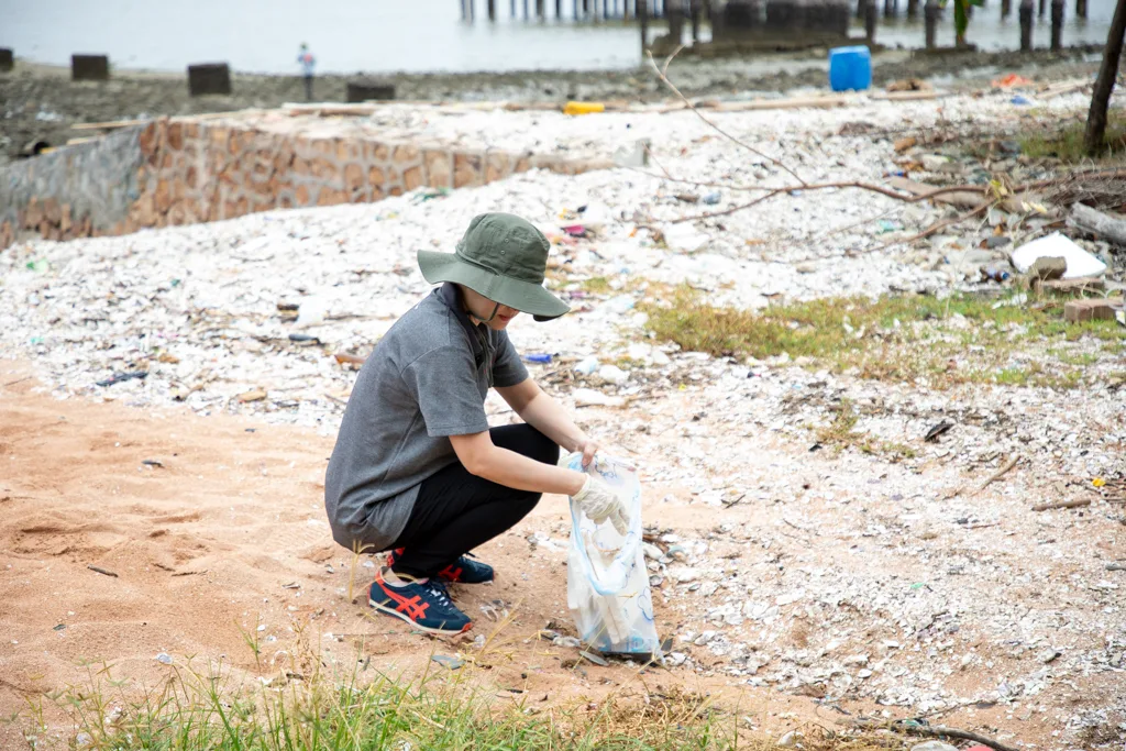 Mussel shell waste covering the shore at Sriracha